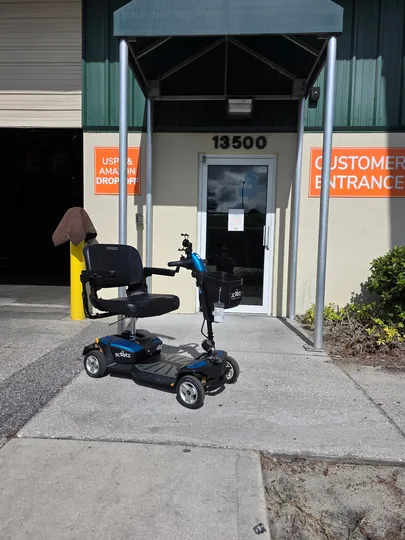 Orlando mobility scooter rentals parked outside an Amazon drop-off location